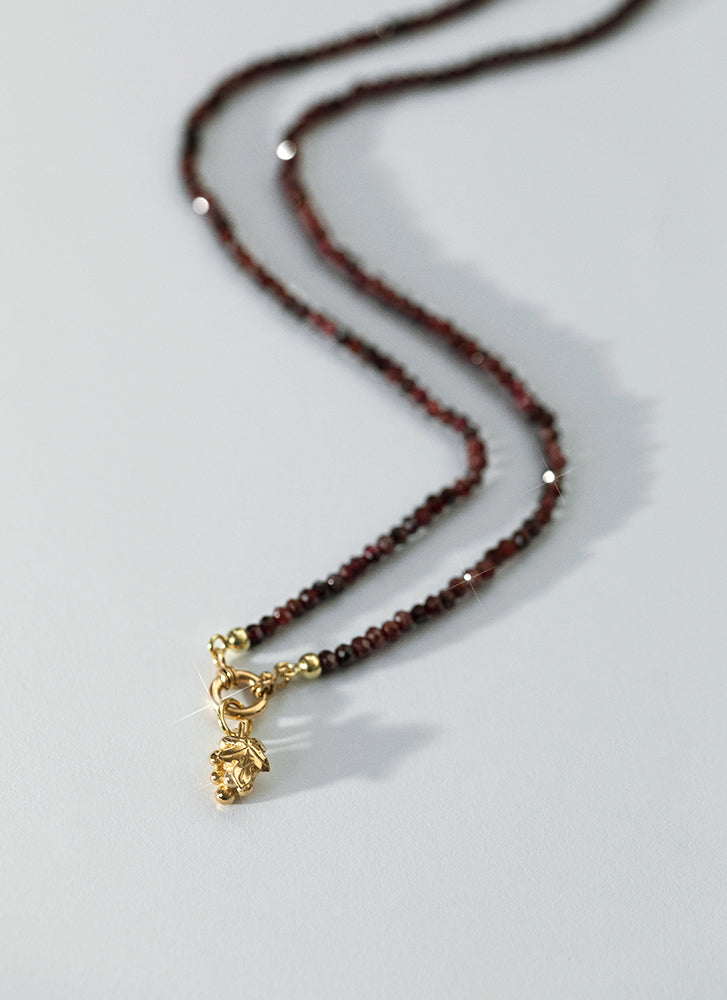 Rosie garnet necklace with front lock 14k gold