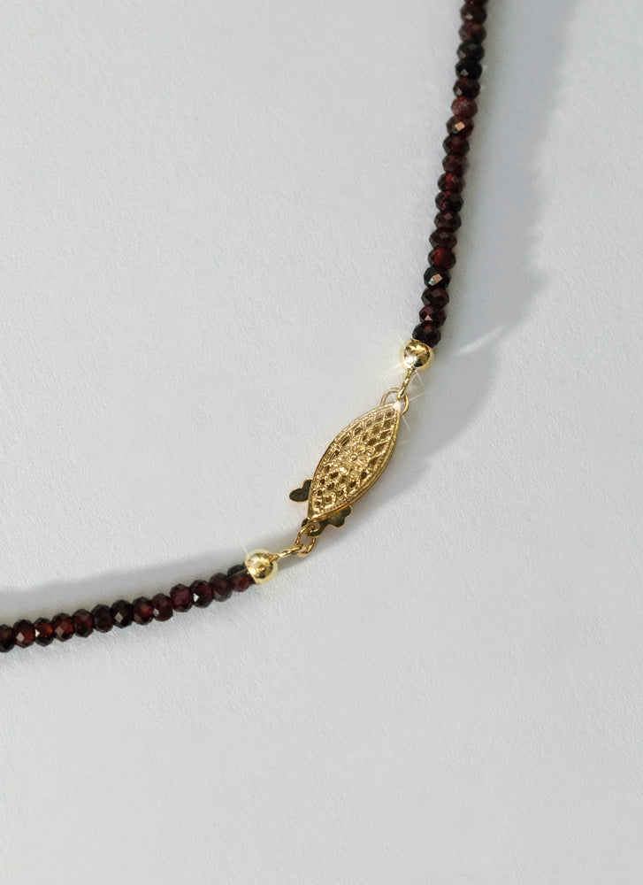 Rosie garnet necklace with front lock 14k gold