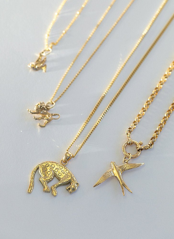 Swallow charm 14k gold - Studio Kroewe